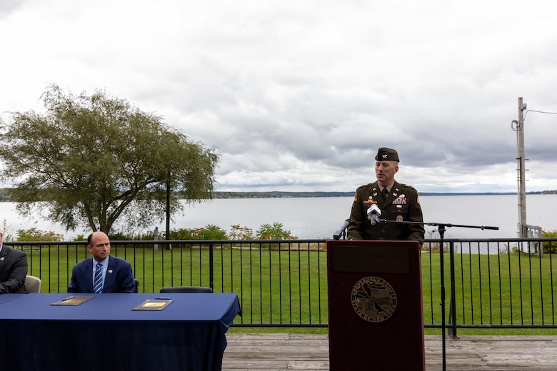 A man speaks at a podium.