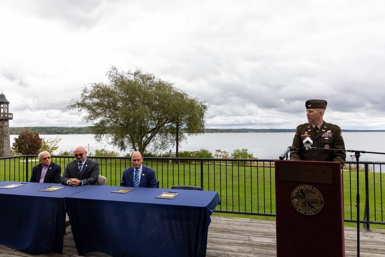 A man speaks at a podium.