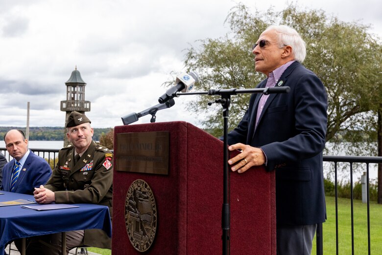 A man speaks at a podium.