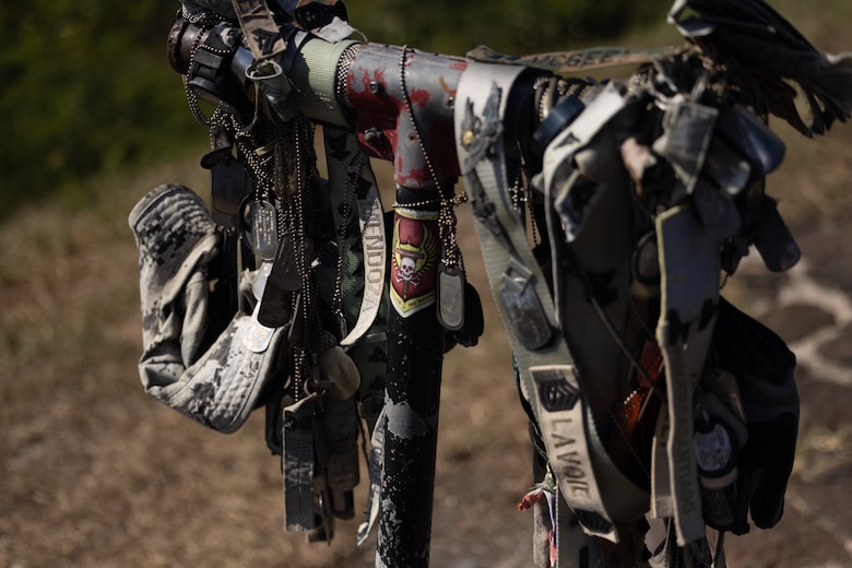 U.S. Marines and Navy Sailors leave behind mementos to honor the fallen service members of the Battle of Iwo Jima during a visit at Iwo To, Japan, May 24, 2024. The Marines and Sailors had the opportunity to hike Mt. Suribachi during a planned PME, providing direct exposure to one of the most historic battle sites in Marine Corps History. The Marines and Sailors are with 12th Marine Littoral Regiment and 4th Marine Regiment, 3d Marine Division.