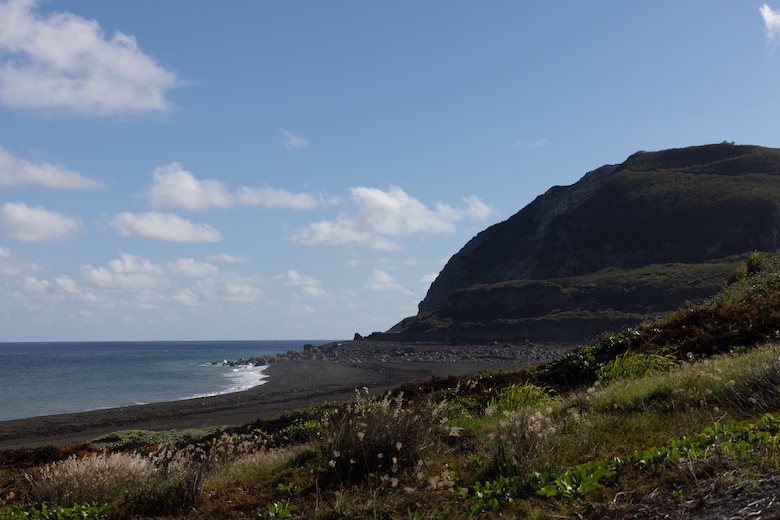 This photo displays the landing beaches utilized by U.S. Marines during the Battle of Iwo Jima on present-day Iwo To, Japan, May 24, 2024. U.S. Marines and Sailors 12th Marine Littoral Regiment had the opportunity to hike Mt. Suribachi during a PME, providing direct exposure to one of the most historic battle sites in Marine Corps History.
