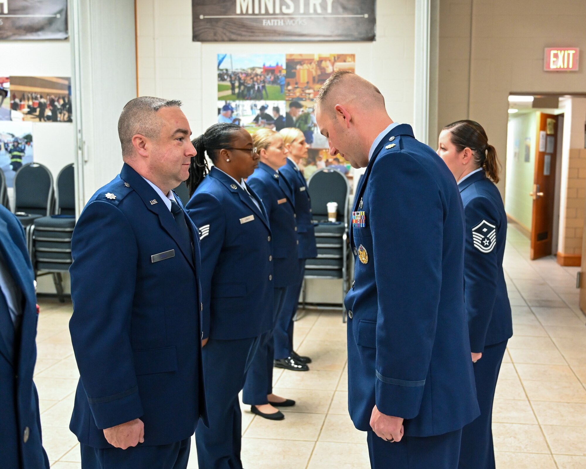 Four women and two men standing in military uniform