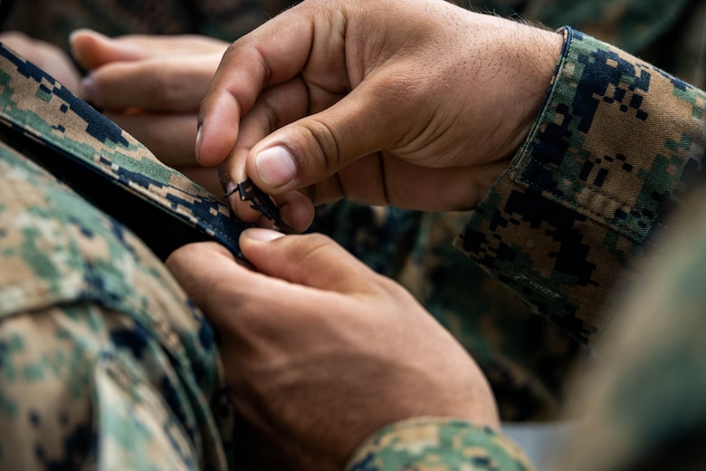 U.S. Marine Corps Lance Cpl. Chue Lee, a radio operator with 12th Marine Littoral Regiment, 3d Marine Division is pinned to the rank of corporal during exercise Resolute Dragon 24 at Japan Ground Self-Defense Force Camp Ishigaki, Okinawa, Japan, Aug. 1, 2024. Cpl. Lee is the first Marine to be promoted into the noncommissioned officer ranks on JGSDF Camp Ishigaki. Cpl Lee’s responsibilities as a corporal in his military occupational specialty range from ensuring the technical and tactical proficiency of his subordinates to the management of more than $600,000 worth of communications gear. RD 24 is an annual bilateral exercise in Japan that strengthens the command, control, and multi-domain maneuver capabilities of U.S. Marines in III Marine Expeditionary Force and Japan Self-Defense Force personnel, with a focus on controlling and defending key maritime terrain. Lee is a native of Alaska.