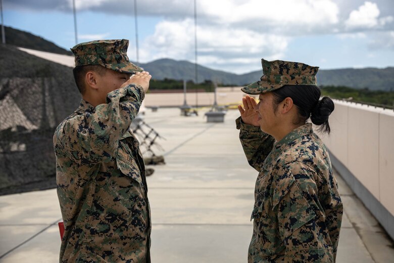 U.S. Marine Corps Lance Cpl. Chue Lee, a radio operator, renders a salute to 1st Lt. Beining Xiao, a communications officer, both with 12th Marine Littoral Regiment, 3d Marine Division during exercise Resolute Dragon 24 at Japan Ground Self-Defense Force Camp Ishigaki, Okinawa, Japan, Aug. 1, 2024. Cpl. Lee is the first Marine to be promoted into the noncommissioned officer ranks on JGSDF Camp Ishigaki. Cpl Lee’s responsibilities as a corporal in his military occupational specialty range from ensuring the technical and tactical proficiency of his subordinates to the management of more than $600,000 worth of communications gear. RD 24 is an annual bilateral exercise in Japan that strengthens the command, control, and multi-domain maneuver capabilities of U.S. Marines in III Marine Expeditionary Force and Japan Self-Defense Force personnel, with a focus on controlling and defending key maritime terrain. Lee is a native of Alaska.