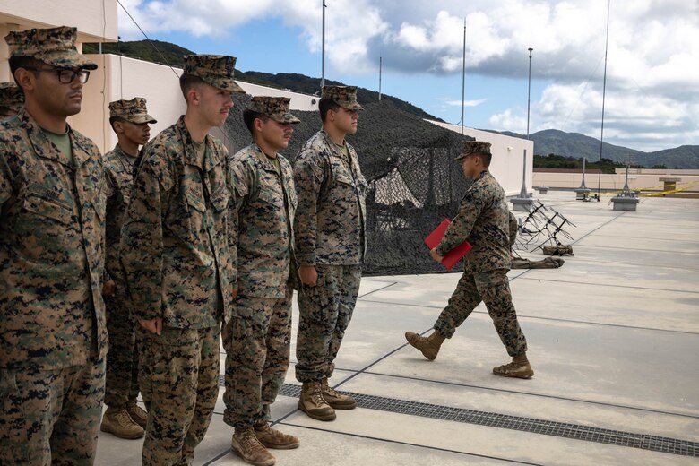 U.S. Marine Corps Lance Cpl. Chue Lee, a radio operator with 12th Marine Littoral Regiment, 3d Marine Division marches to the rear of the formation after his promotion during exercise Resolute Dragon 24 at Japan Ground Self-Defense Force Camp Ishigaki, Okinawa, Japan, Aug. 1, 2024. The promotion ceremony signified Lee’s advancement to the noncommissioned officer ranks of the Marine Corps, marking a new level of responsibility and leadership. RD 24 is an annual bilateral exercise in Japan that strengthens the command, control, and multi-domain maneuver capabilities of U.S. Marines in III Marine Expeditionary Force and Japan Self-Defense Force personnel, with a focus on controlling and defending key maritime terrain. Lee is a native of Alaska.