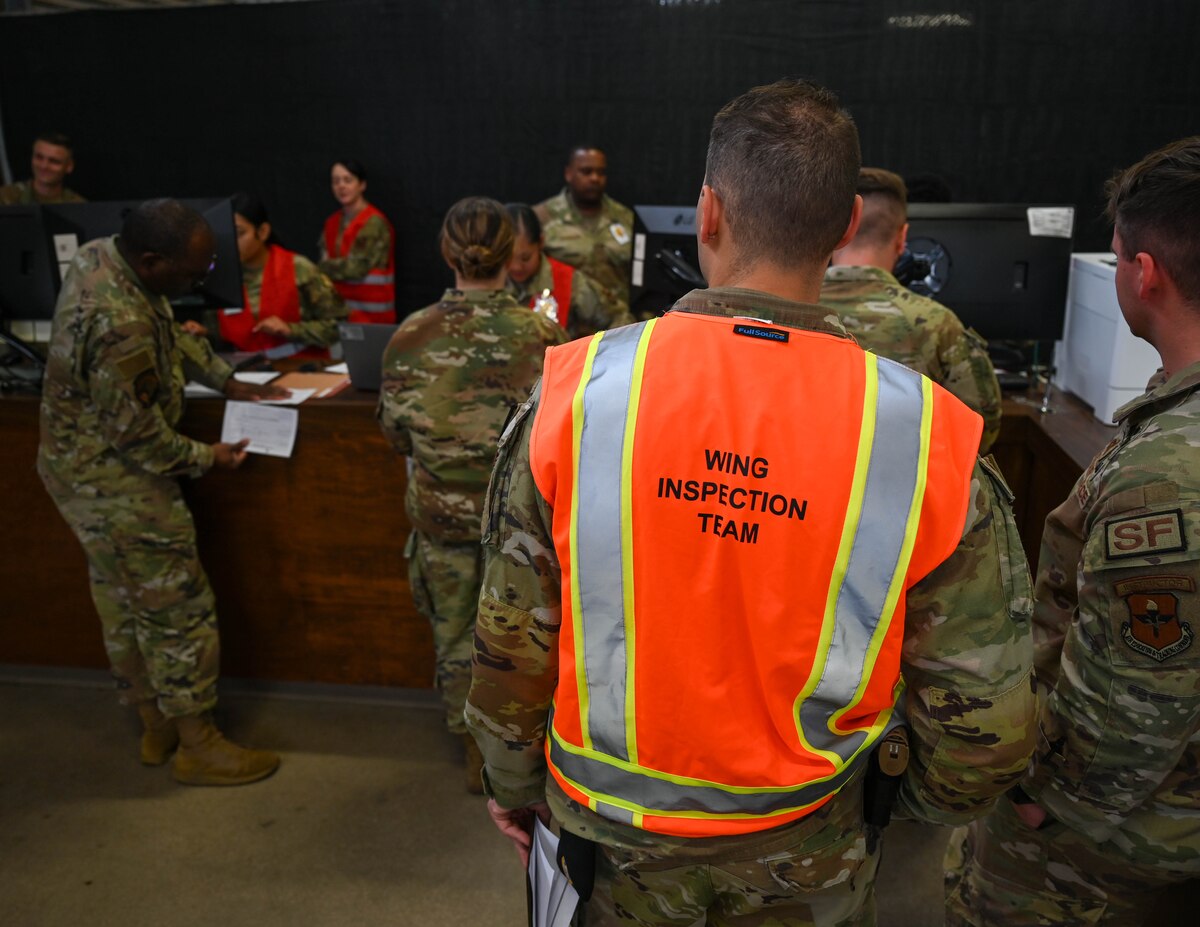 The 17th Training Wing Inspection Team observes deployers moving through the deployment line at the Vance Deployment Center, Goodfellow Air Force Base, Texas, Oct. 17, 2024. The exercise ensured Goodfellow’s ability to rapidly and effectively deliver Airmen anywhere on the planet. (U.S. Air Force photo by Senior Airman Zach Heimbuch)