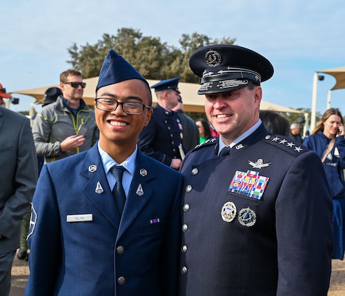 U.S. Space Force Chief of Space Operations Gen. Chance Saltzman poses for a photo with a Guardian who recently graduated Basic Military Training at Joint Base San Antonio-Lackland, Texas, Oct. 17, 2024. More than 800 Guardians and Airmen assigned to Flights 643-660 marched in the 737th Training Group’s graduation parade for which Saltzman was the reviewing official. The ceremony is one of three U.S. Air Force and Space Force Basic Military Training graduation events and signifies the transition from trainee to Airman or Guardian. (U.S. Air Force photo by Jonathan Cotto)