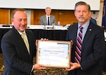 Andrew Lochli presents the Jack Donnelly Award for Excellence in Counterintelligence to MTU