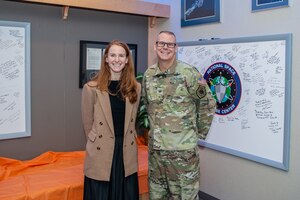 Man and woman pose for photo