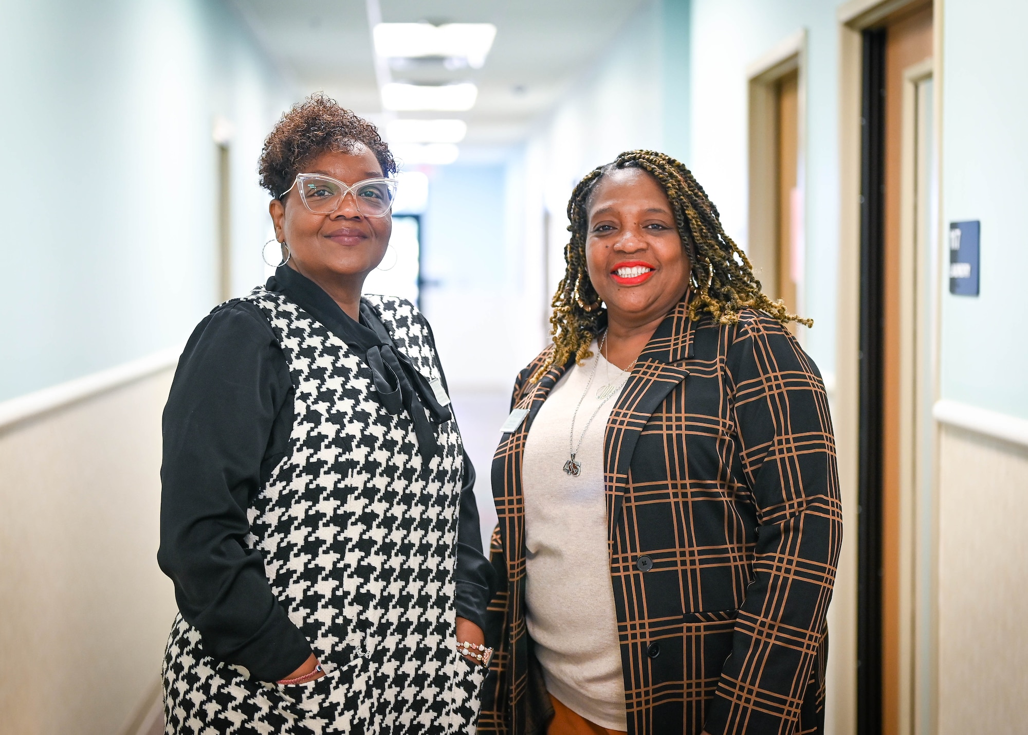 Two women, CDC assistant directors, pose for a photo side-by-side.