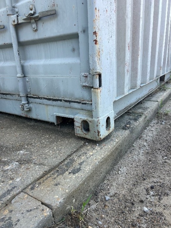 The hole in the bottom corner of the ISO-Type Container is where the roller jack would be inserted.