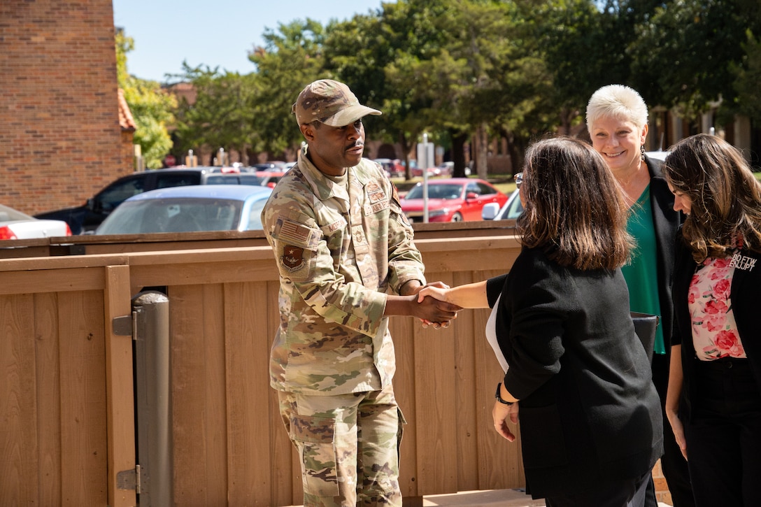 Mrs. Maureen Robinson, spouse of U.S. Air Force Lt. Gen. Brian Robinson, commander of Air Education and Training Command, is greeted by CMSgt Wilfred Morgan, NCOA Commandant during a tour of Midwestern State University’s campus facilities