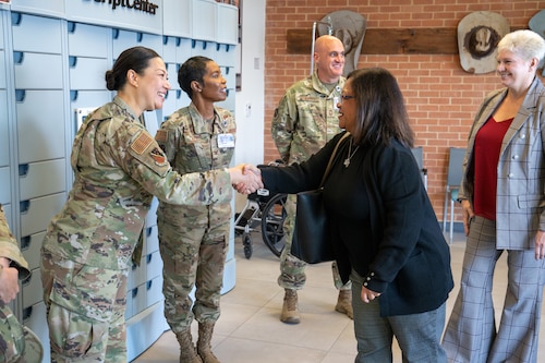 Mrs. Maureen Robinson, spouse of U.S. Air Force Lt. Gen. Brian Robinson, commander of Air Education and Training Command, greets leadership and personnel during a tour of the 82d Medical Group