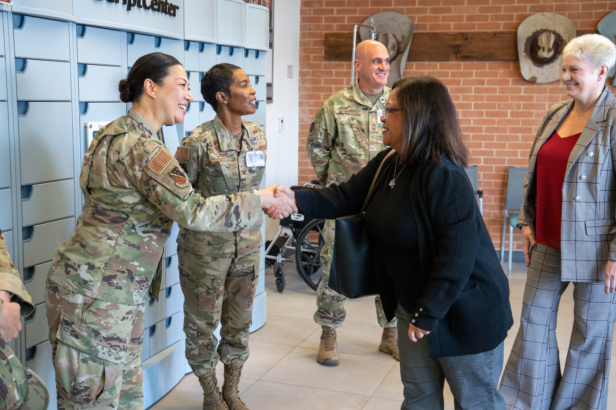 Mrs. Maureen Robinson, spouse of U.S. Air Force Lt. Gen. Brian Robinson, commander of Air Education and Training Command, greets leadership and personnel during a tour of the 82d Medical Group