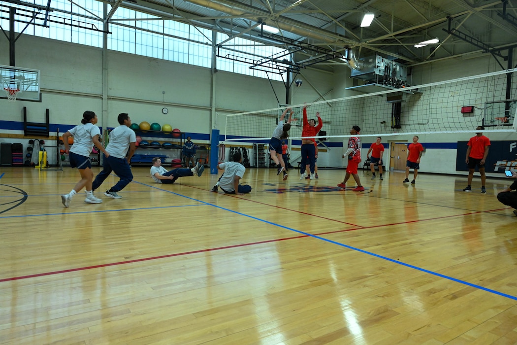 Airmen from the 97th Mission Support Group (MSG) participate in a game of volleyball during the MSG sports day event at Altus Air Force Base, Oklahoma, Oct. 18, 2024. The event was held to foster camaraderie, physical fitness, and overall well-being amongst its members. (U.S. Air Force photo by Senior Airman Miyah Gray)