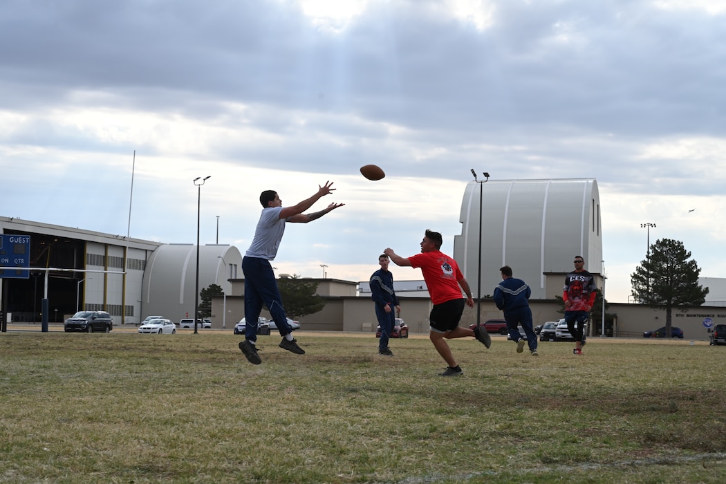 U.S. Air Force Airman 1st Class Isaiah Jones, 97th Contracting Flight contracting specialist, catches a football during the 97th Mission Support Group (MSG) sports day event at Altus Air Force Base, Oklahoma, Oct. 18, 2024. The event gave Airmen throughout the 97th MSG the opportunity to engage in friendly competition. (U.S. Air Force photo by Airman 1st Class Lauren Torres)