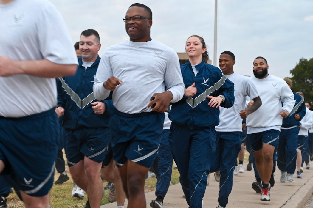 Airmen from the 97th Mission Support Group (MSG) run during the MSG sports day event at Altus Air Force Base, Oklahoma, Oct. 18, 2024. The participants began their morning with a one-mile run to kick off the event. (U.S. Air force photo by Senior Airman Miyah Gray)