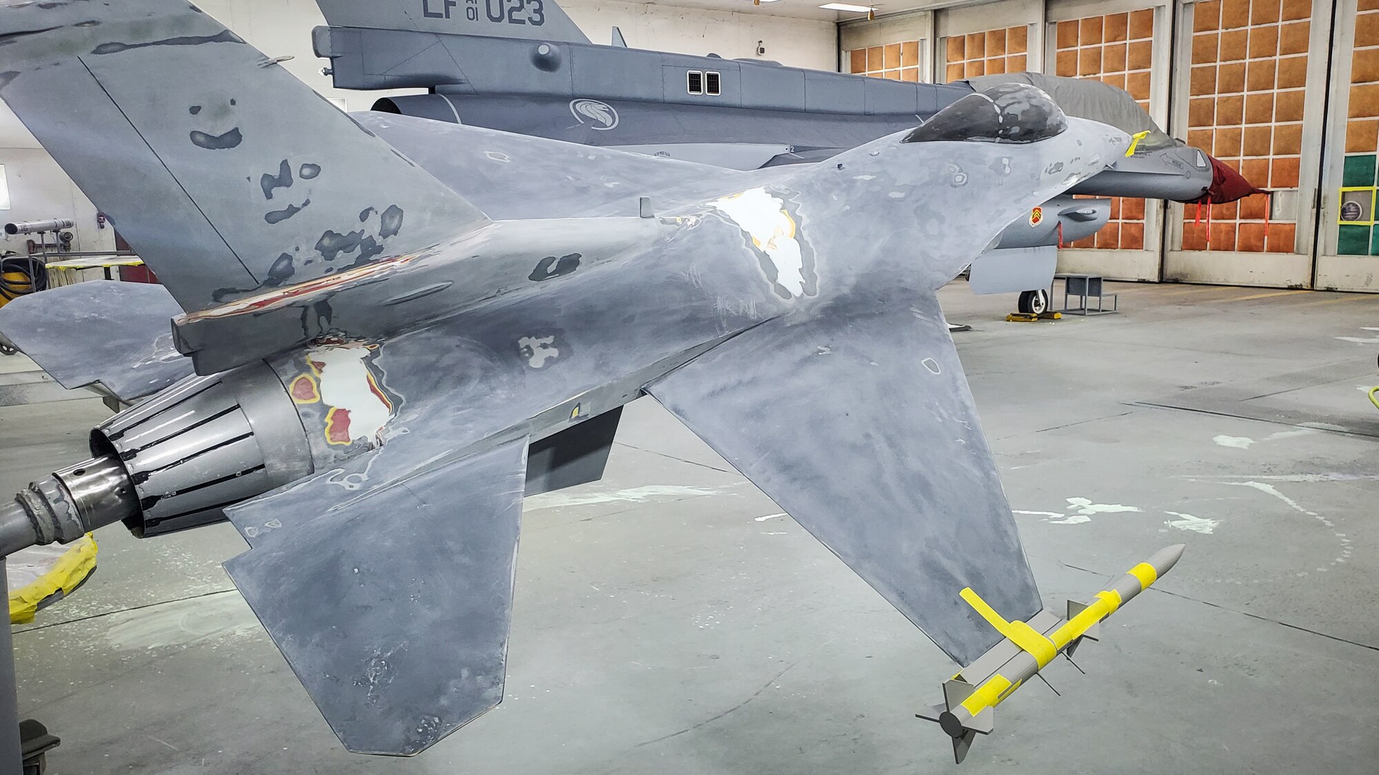 The F-16 static display at Luke Air Force Base, Ariz., August 26, 2024, is seen mid-restoration with repairs underway to its nose and body. The restoration team worked meticulously over several weeks to restore the aircraft to its original appearance. (Contributed photo)