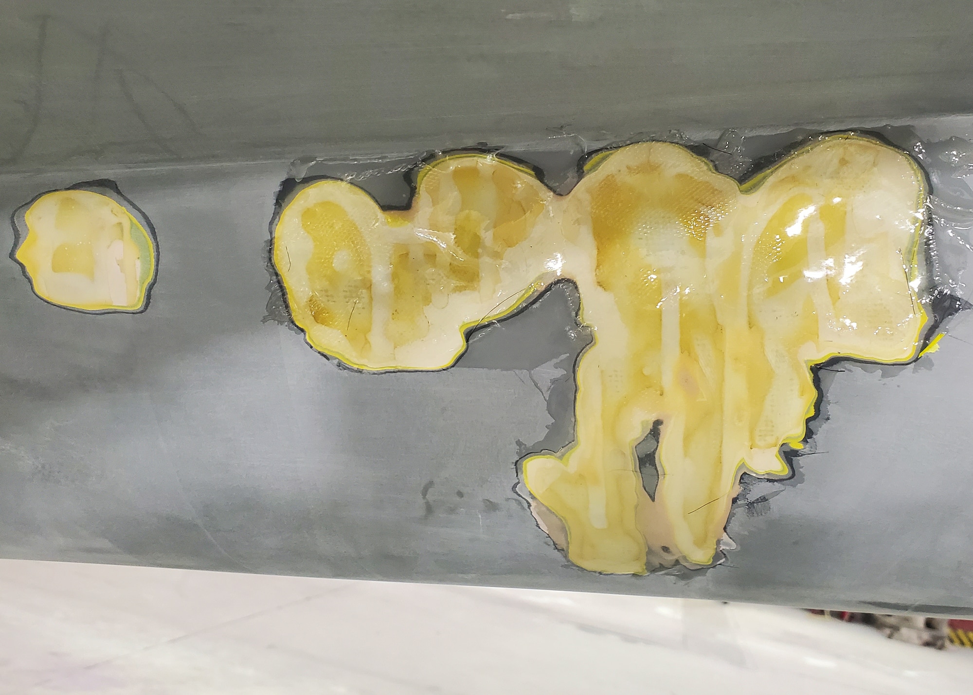 Close-up of structural damage to the F-16 static display’s fuselage at Luke Air Force Base, Ariz., August 16, 2024. Restoration efforts included repairing damaged fiberglass and reinforcing weakened sections of the aircraft. (Contributed photo)