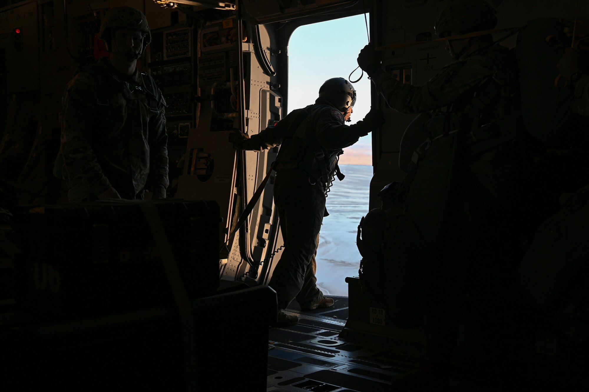 U.S. Army paratroopers from the 1st Battalion, 501st Parachute Infantry Regiment, 4th Infantry Brigade Combat Team (Airborne), 25th Infantry Division, prepare for an airborne jump during Joint Forcible Entry operations in Alaska, Oct. 15, 2024.