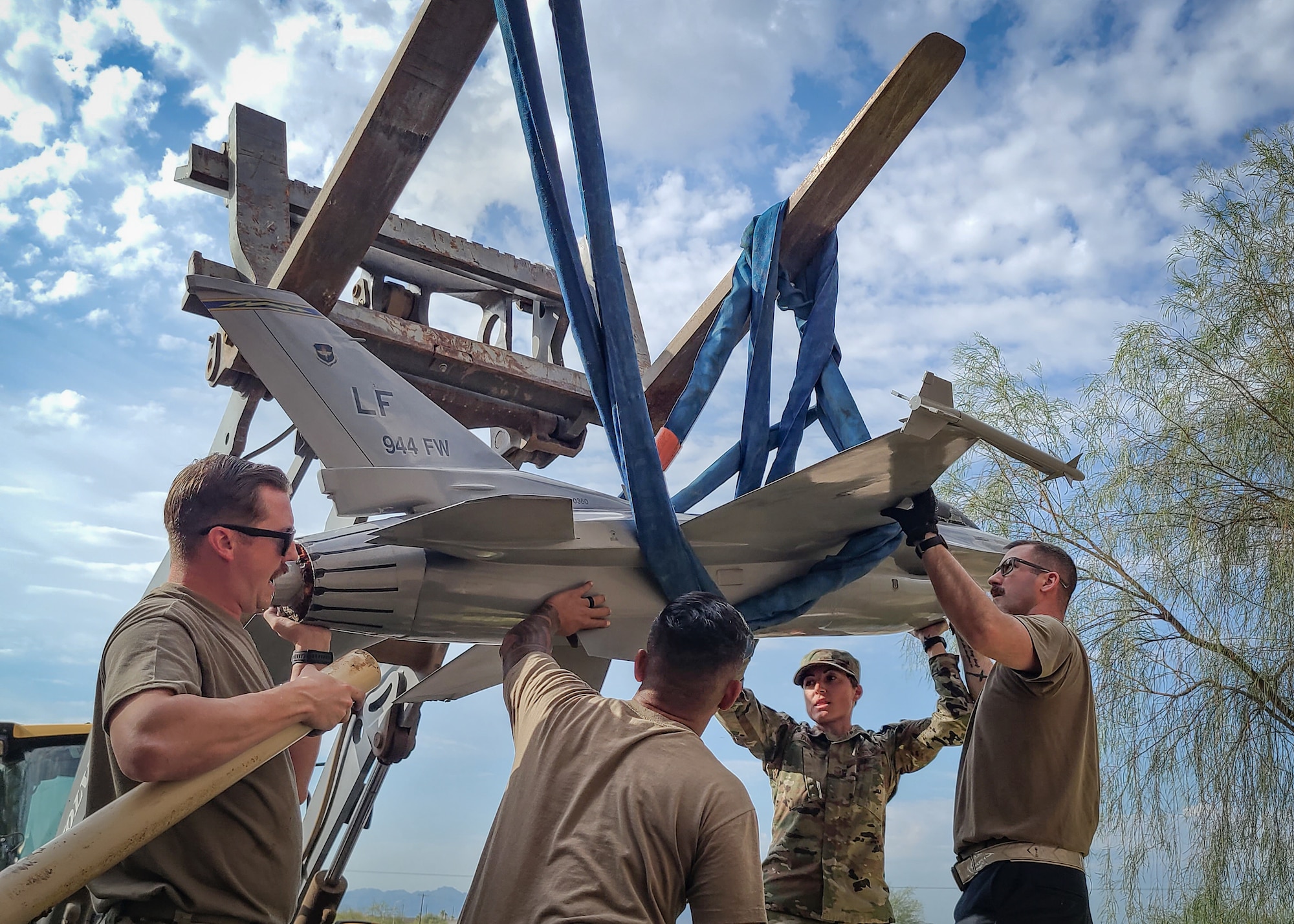 944th Fighter Wing personnel begin the removal of the F-16 static display at Luke Air Force Base, Ariz., August 1, 2024. The aircraft was carefully lifted from its base to undergo a complete restoration, including repairs to its exterior surfaces. (Contributed photo)