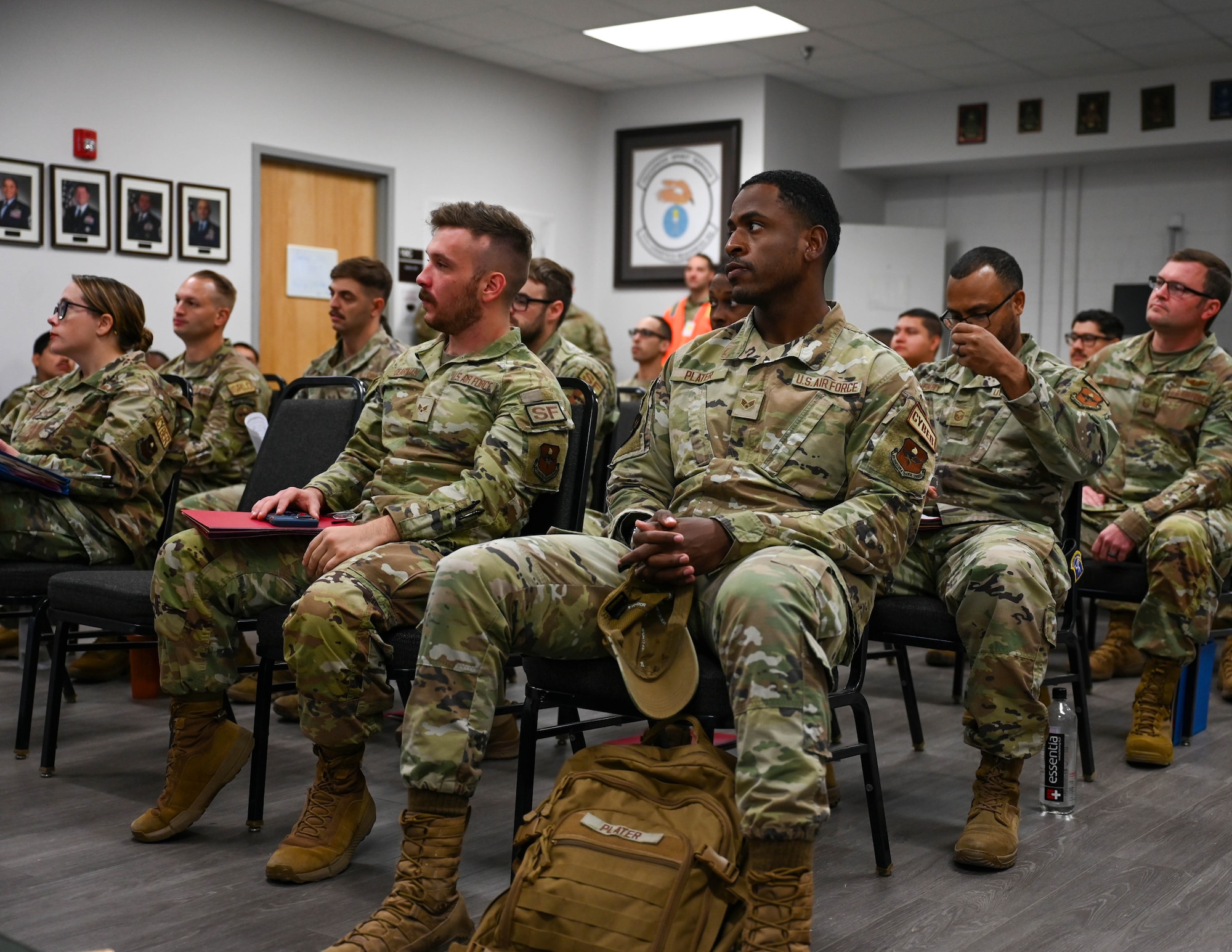 Members of the 17th Training Wing receive the Personnel Deployment Function Briefing at the Vance Deployment Center, Goodfellow Air Force Base, Texas, Oct. 17, 2024. The briefing covered facilities available during the deployment and habits to stay healthy while overseas. (U.S. Air Force photo by Senior Airman Zach Heimbuch)
