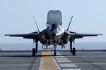 An F-35B Lightning II lands aboard JS Kaga (DDH-184) to begin developmental testing.