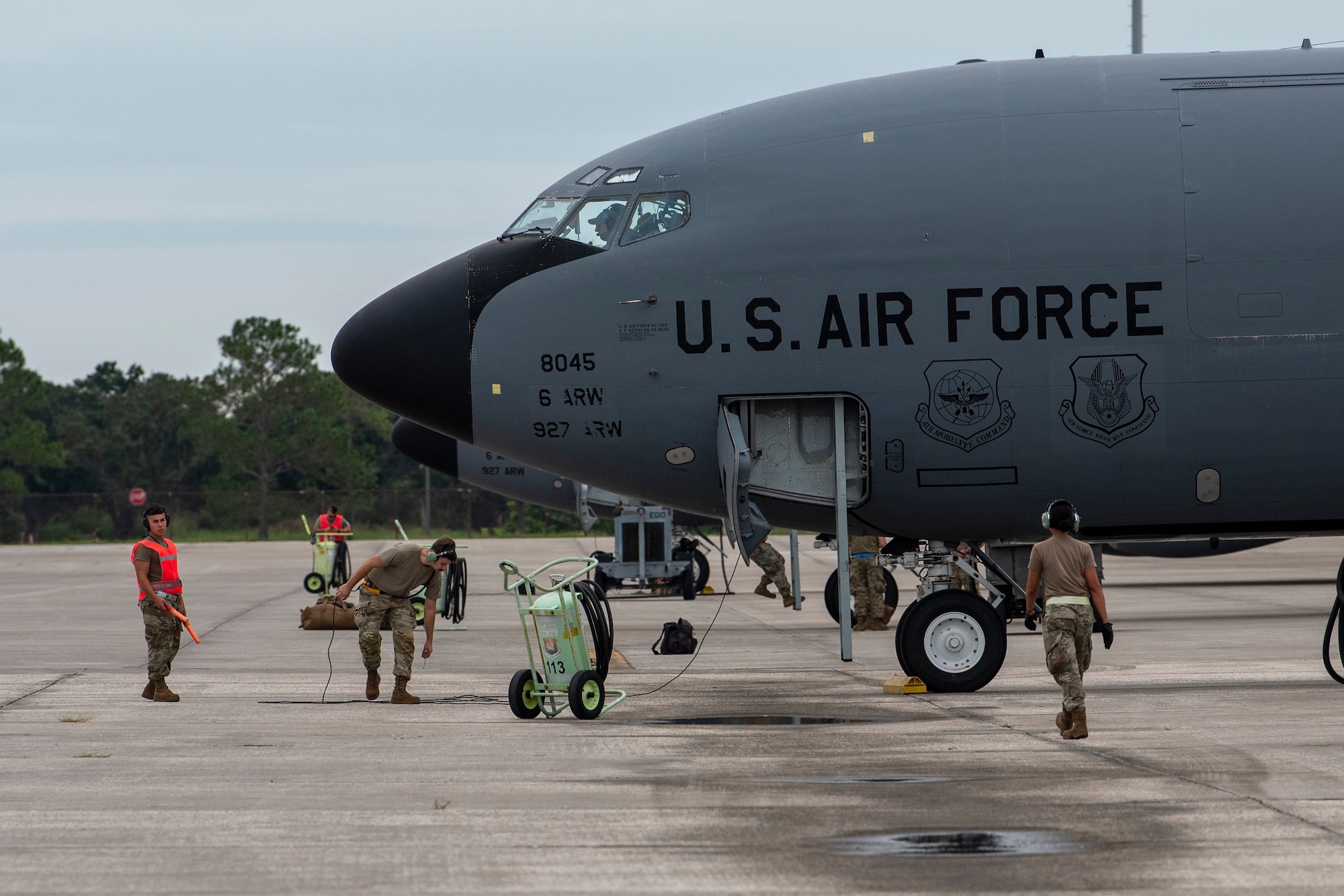 Members of the 927th Maintenance Group and the 6th Maintenance Group work together to prepare a KC-135 Stratotanker aircraft to evacuate MacDill Air Force Base, Florida, Oct. 6, 2024. The aircraft evacuation is part of MacDill’s preparations for Hurricane Milton forecasted to impact the west coast of Florida later this week. (U.S. Air Force photo by Staff Sgt. Leah Ritchey)