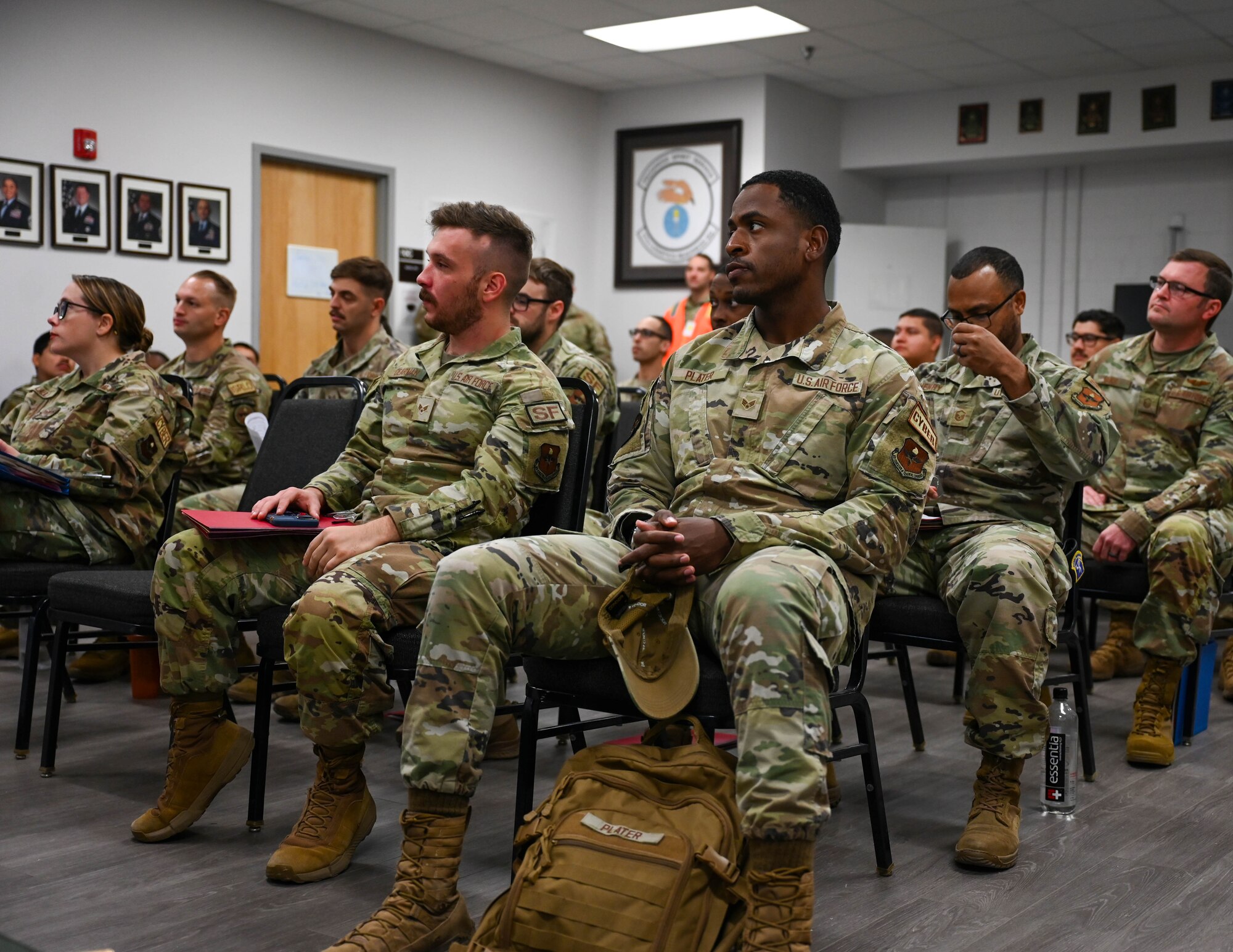 Members of the 17th Training Wing receive the Personnel Deployment Function Briefing at the Vance Deployment Center, Goodfellow Air Force Base, Texas, Oct. 17, 2024. The briefing covered facilities available during the deployment and habits to stay healthy while overseas. (U.S. Air Force photo by Senior Airman Zach Heimbuch)