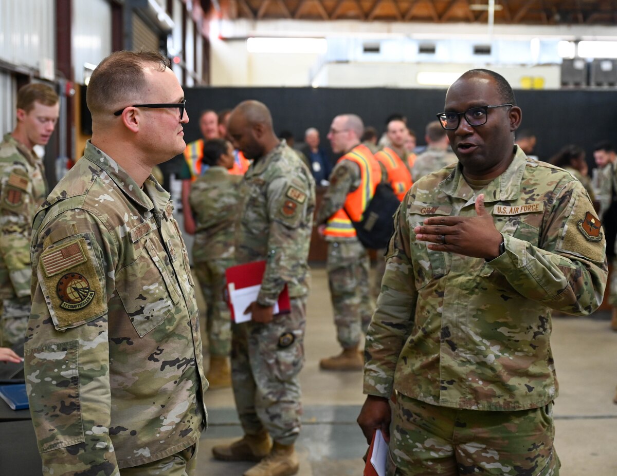 U.S. Air Force Tech. Sgt. Andy Harrison,17th Training Wing Wing Staff Agencies unit deployment manager, and Tech. Sgt. Bradley Gray, 17th TRW Wing Safety noncommissioned officer in charge, discuss facilities available during deployments at the Vance Deployment Center, Goodfellow Air Force Base, Texas, Oct. 17, 2024. Deploying members were accompanied by their squadron’s UDMs to help organize the process. (U.S. Air Force photo by Senior Airman Zach Heimbuch)