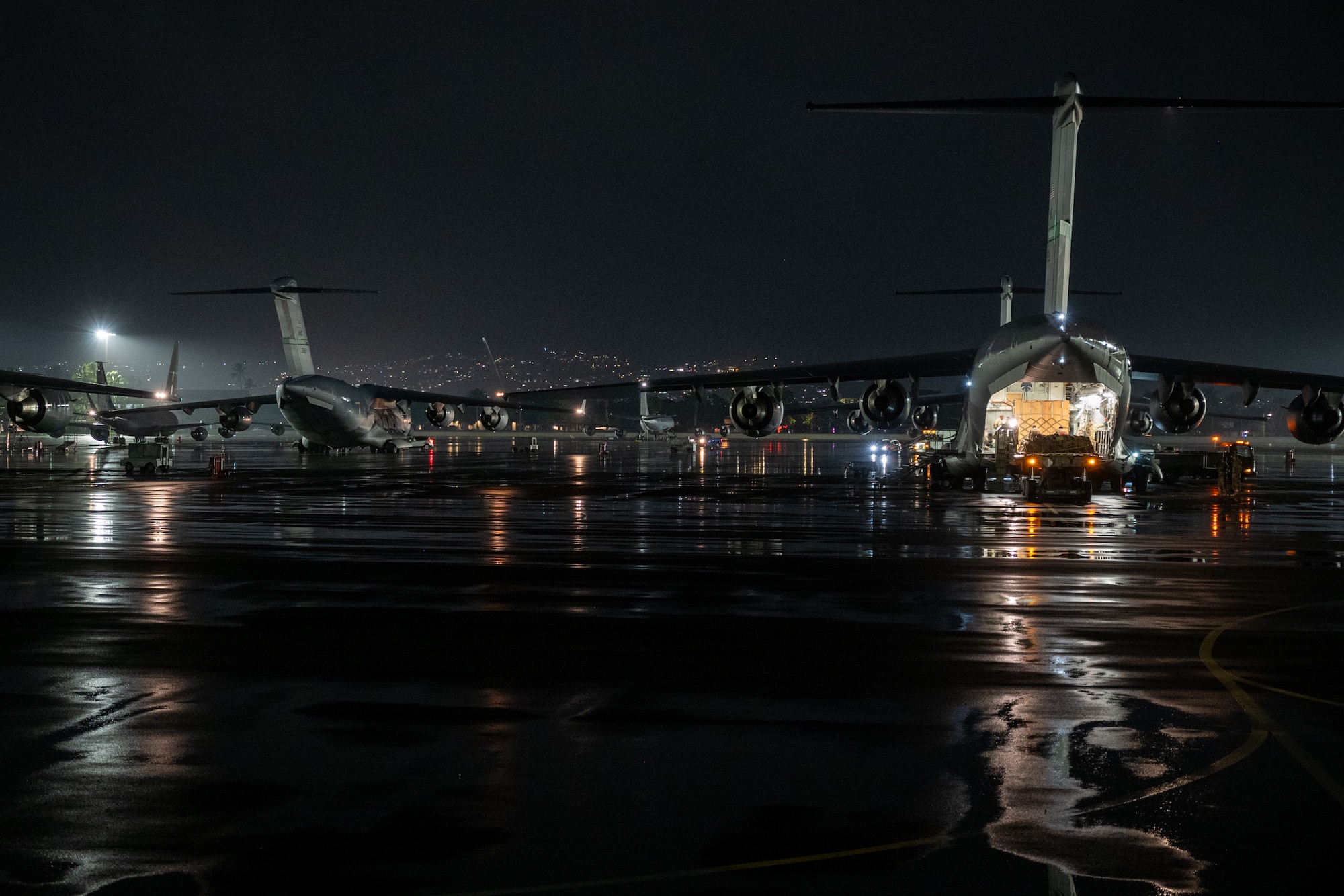 U.S. Air Force C-17 Globemaster IIIs prepare to depart Daniel K. Inouye International Airport as part of the largest Joint Forcible Entry exercise to date, Honolulu, Hawaii, Oct. 14, 2024.