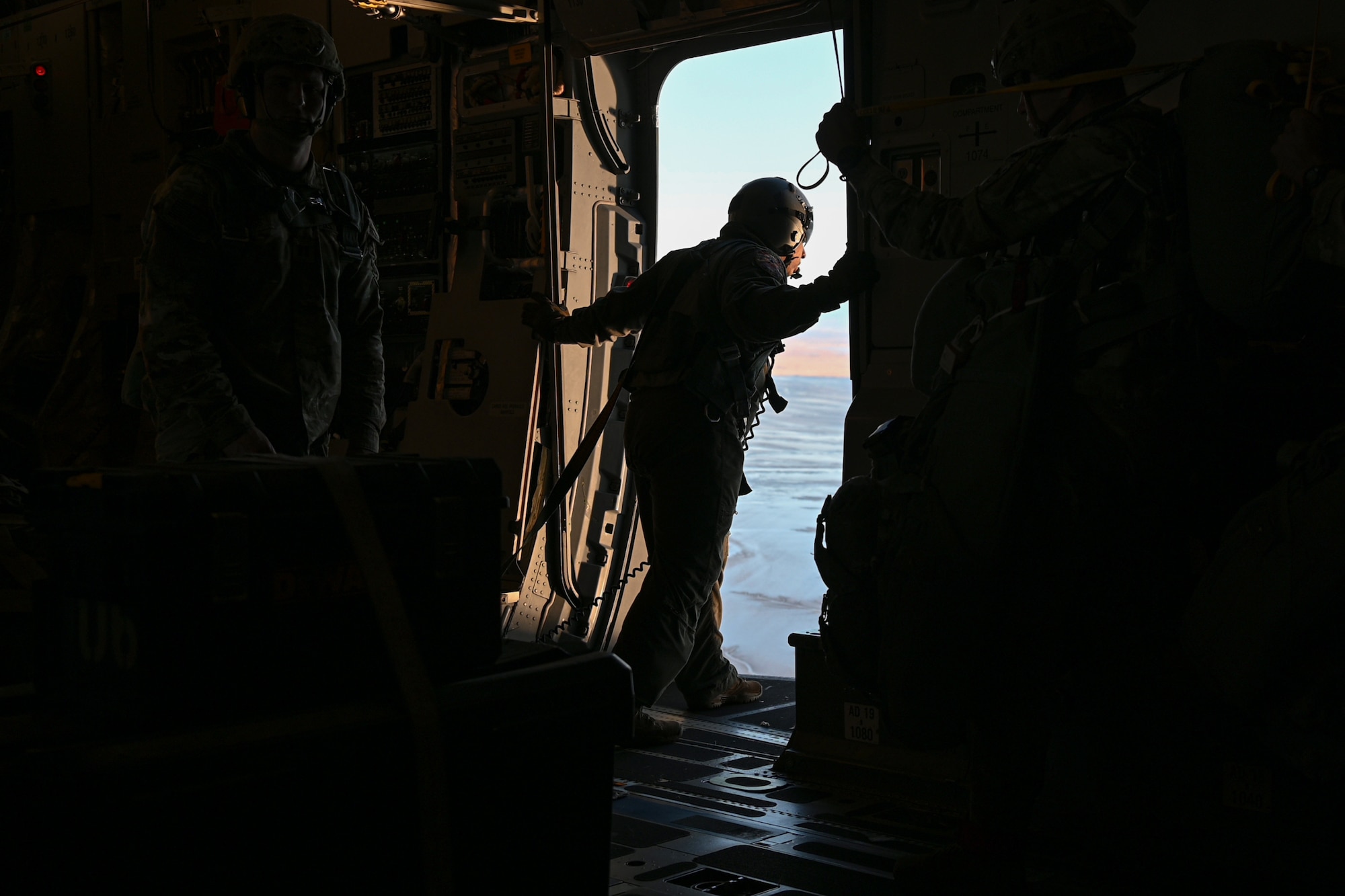 U.S. Army paratroopers from the 1st Battalion, 501st Parachute Infantry Regiment, 4th Infantry Brigade Combat Team (Airborne), 25th Infantry Division, prepare for an airborne jump during Joint Forcible Entry operations in Alaska, Oct. 15, 2024.