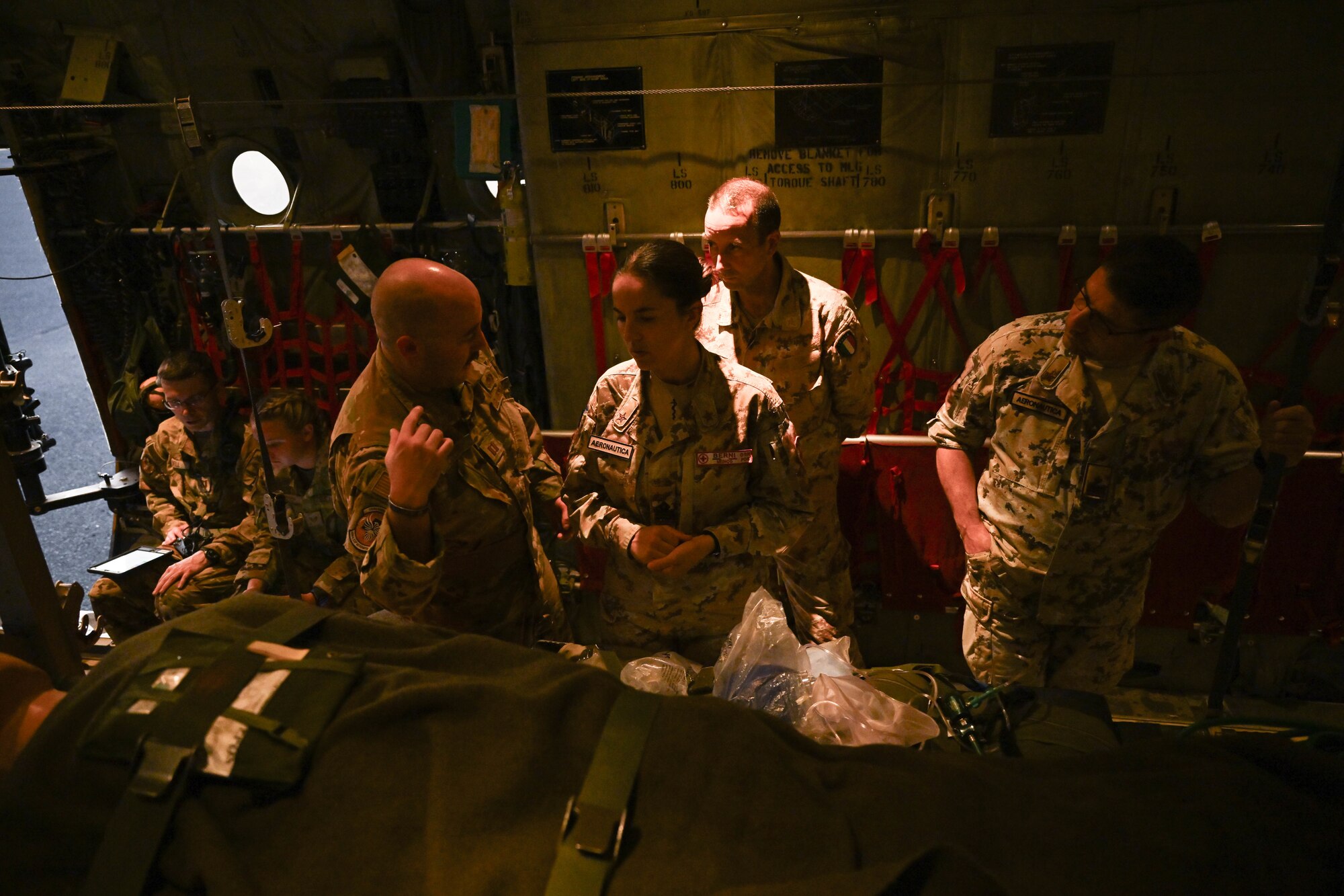 A group of people are inside an aircraft.