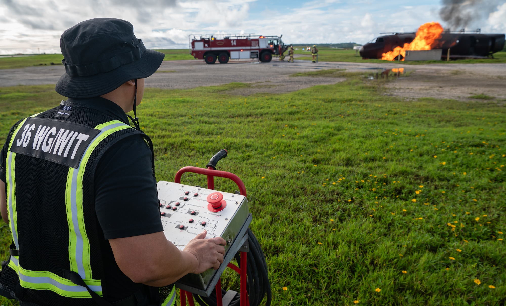 A 36th Wing Inspection Team member masterminds a controlled burn scenario during a major accident response exercise (MARE) for Slingstone 24-4 at Andersen Air Force, Guam, Oct. 22, 2024. The MARE allows first responders to hone the skills needed should a real accident happen. Operational Readiness Exercise, Slingstone 24-4, aims to improve the Forward Edge and its Airmen in the competitive region that is the Indo-Pacific. (U.S. Air Force photo by Staff Sgt. Pedro Tenorio)