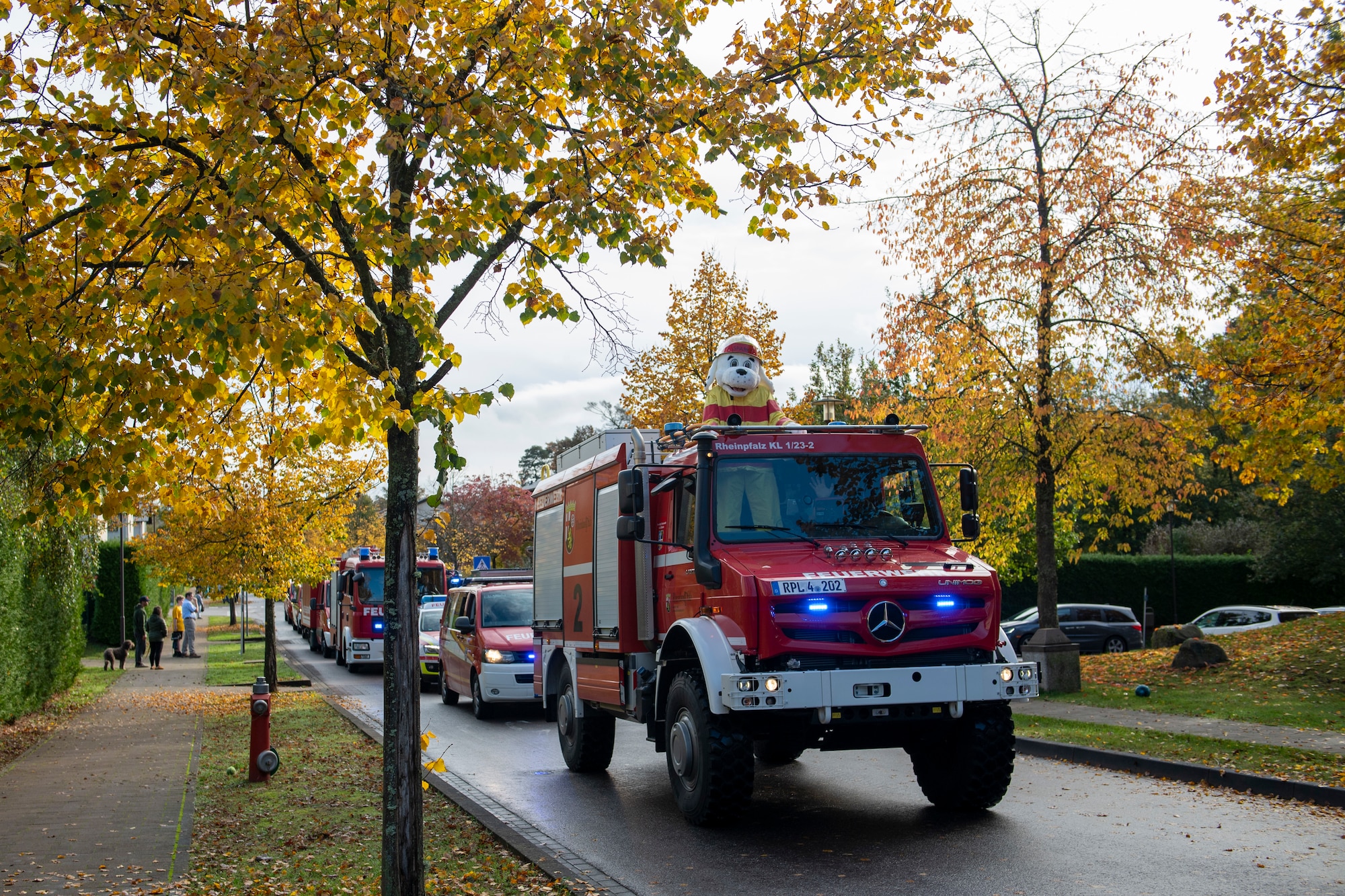 Sparky the Dog ride in a fire truck.