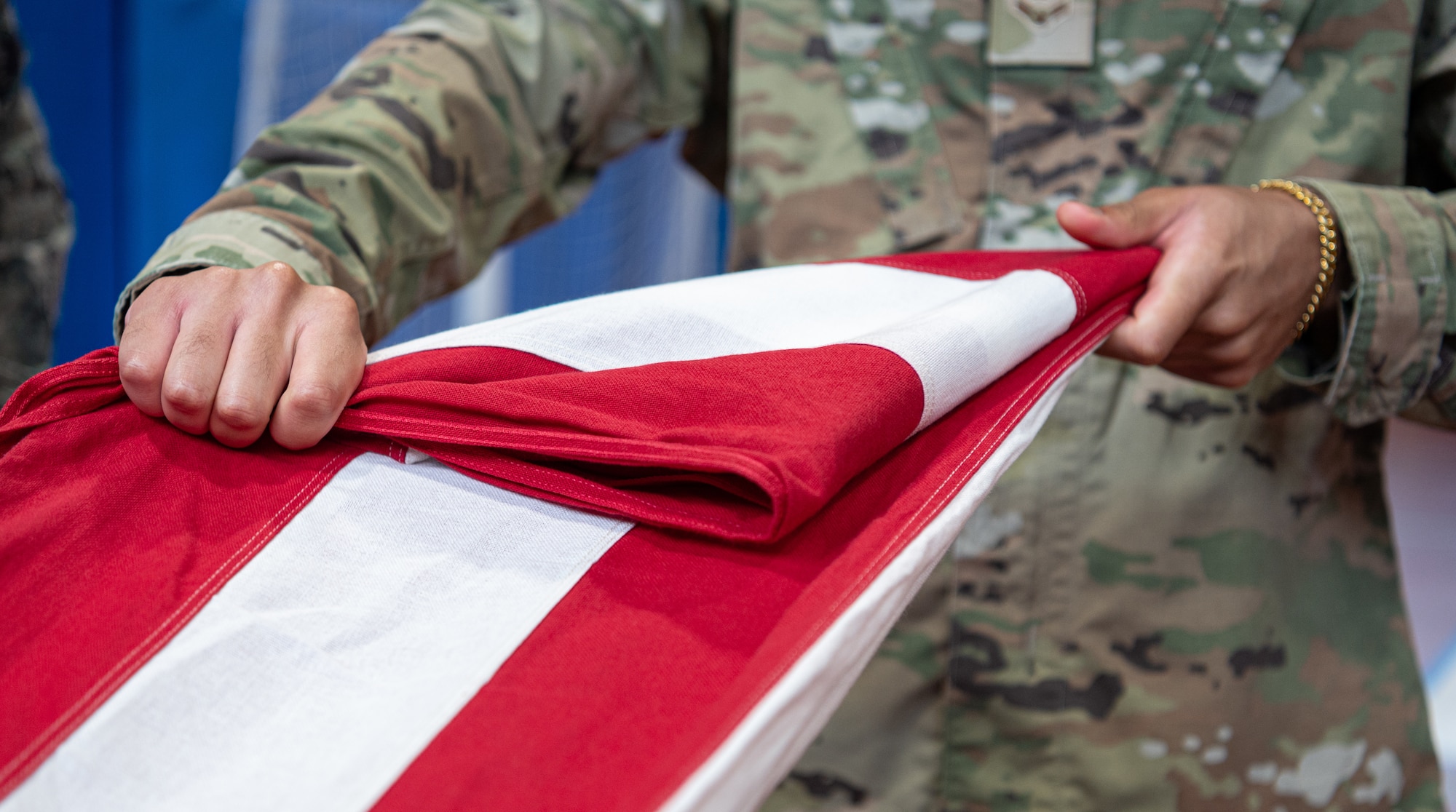 U.S. Air Force Airman 1st Class Bryce Pinkard, Royal Air Force Mildenhall honor guardsman, demonstrates a flag fold during an honor guard practice at RAF Mildenhall, England, Sept. 3, 2024.
