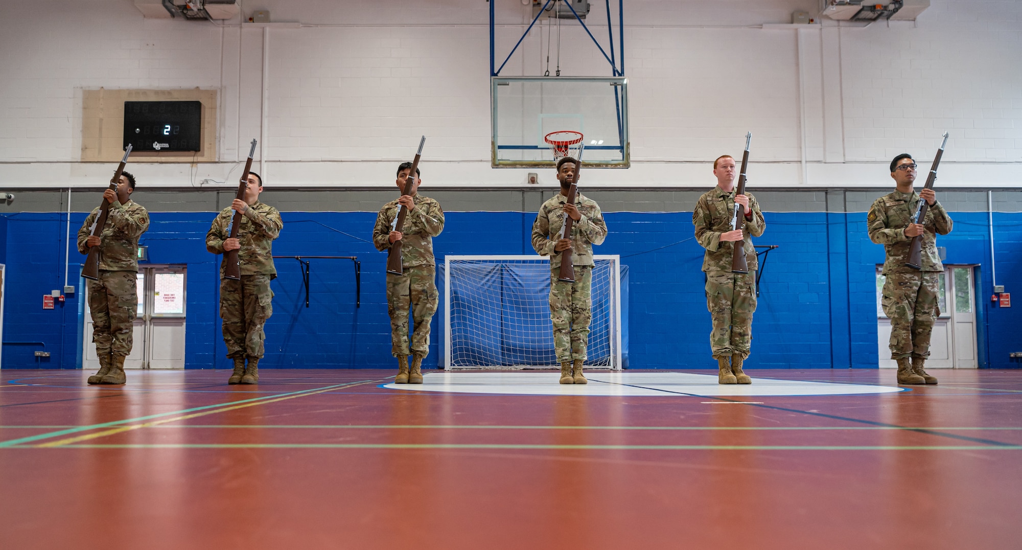 The Royal Air Force Mildenhall Honor Guard perform rifle movements during a practice at RAF Mildenhall, England, Sept. 3, 2024.