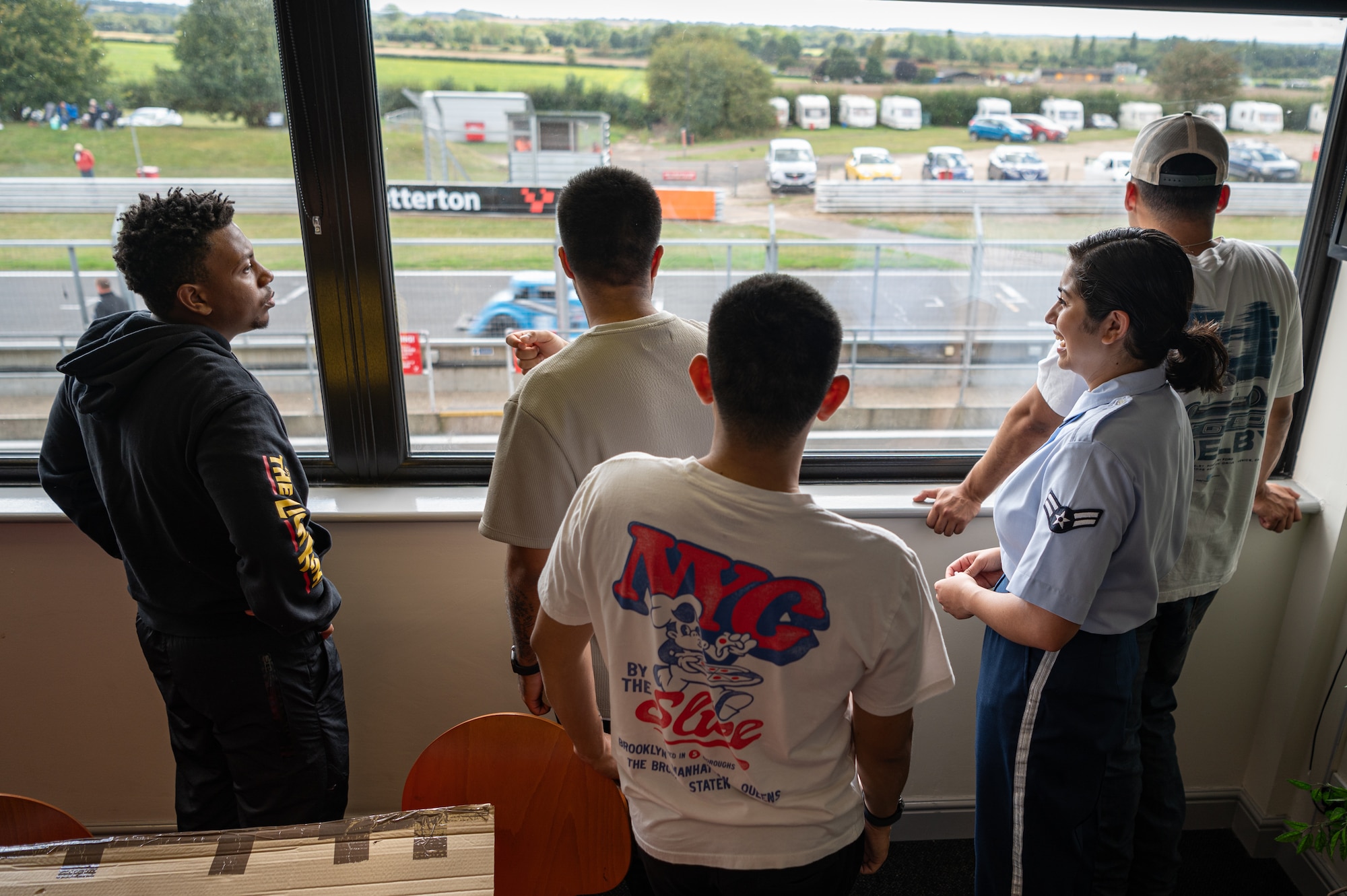 The Royal Air Force Mildenhall Honor Guard survey the area for their ceremony at the USA Snetterton 300 race in Norfolk, England, Sept. 8, 2024.