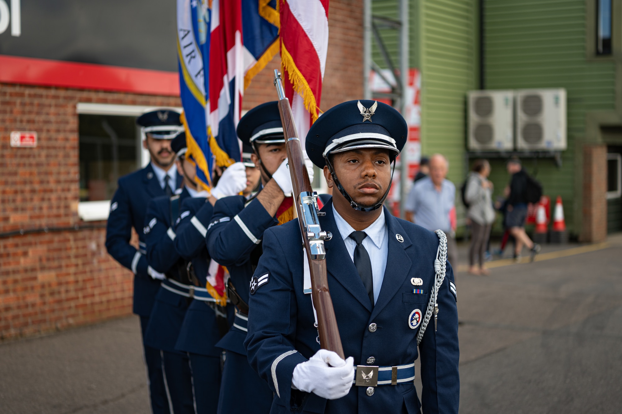 The Royal Air Force Mildenhall Honor Guard approaches the race track at the USA Snetterton 300 race in Norfolk, England, Sept. 8, 2024.
