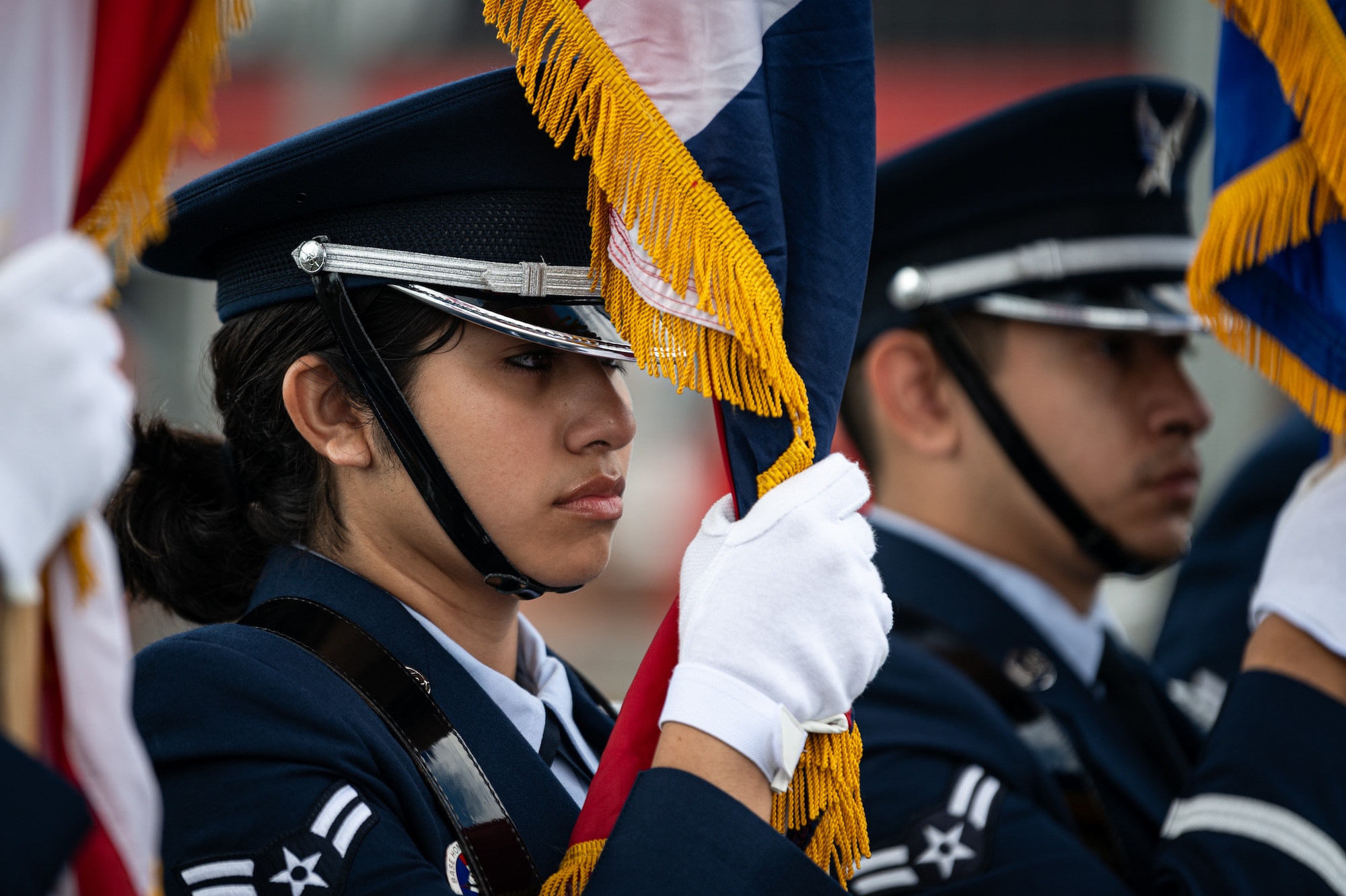 U.S. Air Force Airman 1st Class Naisha Blanco, Royal Air Force Mildenhall Honor Guardsman, performs ceremonial duties alongside other guardsmen during the USA Snetterton 300 race in Norfolk, England, Sept. 8, 2024.