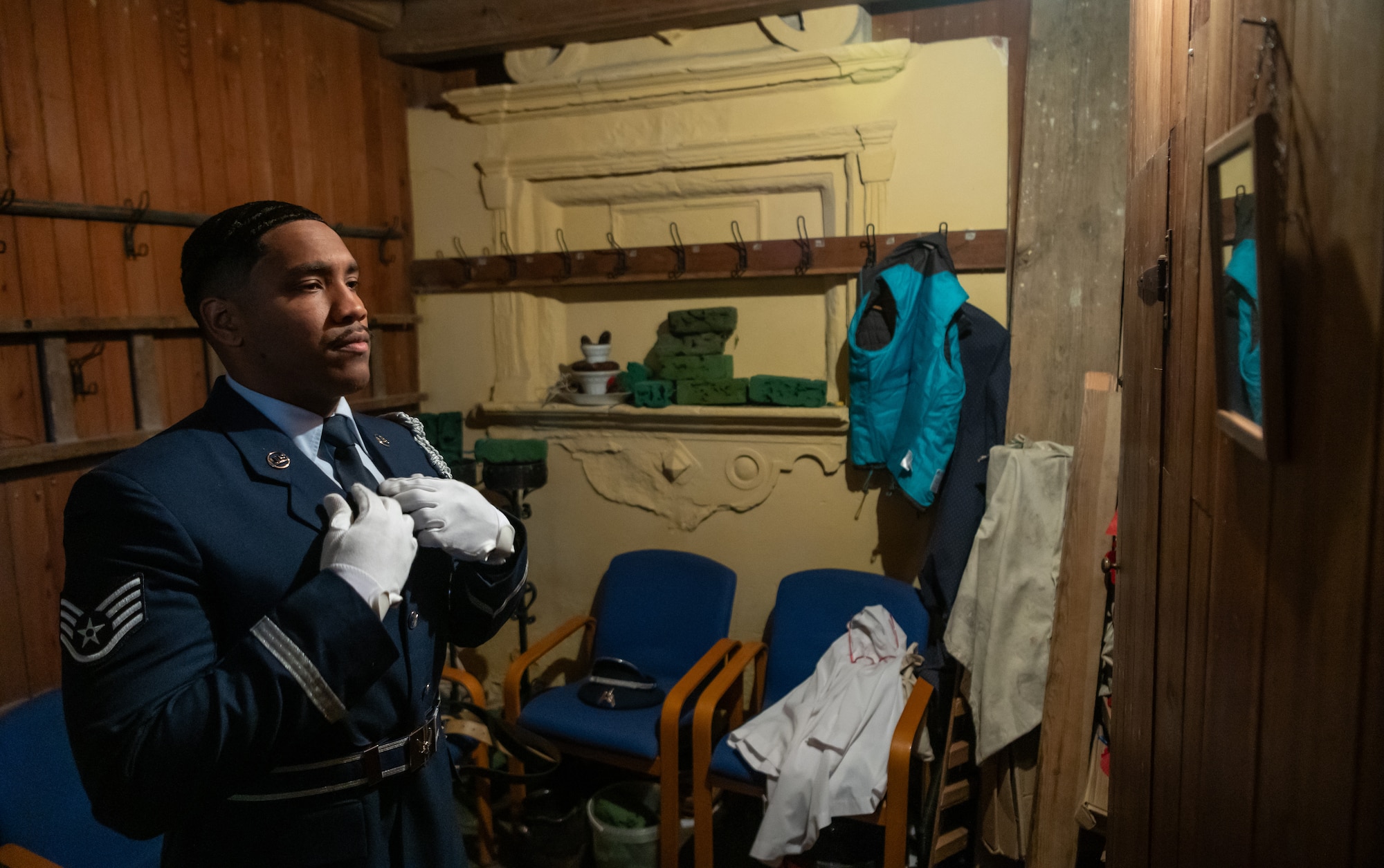 U.S. Air Force Staff Sgt. Devaundre Carmona, Royal Air Force Mildenhall Honor Guardsman, gets ready for a detail at St. Andrews Church, Honingham Norfolk, England, Oct. 20, 2024.