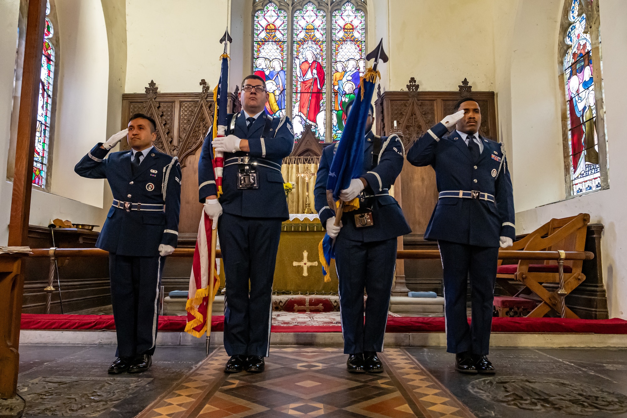 U.S. Airmen with the Royal Air Force Mildenhall Honor Guard perform ceremonial duties  during the playing of the U.K. national anthem at the St. Andrews Church, Honingham Norfolk, England, Oct. 20, 2024.
