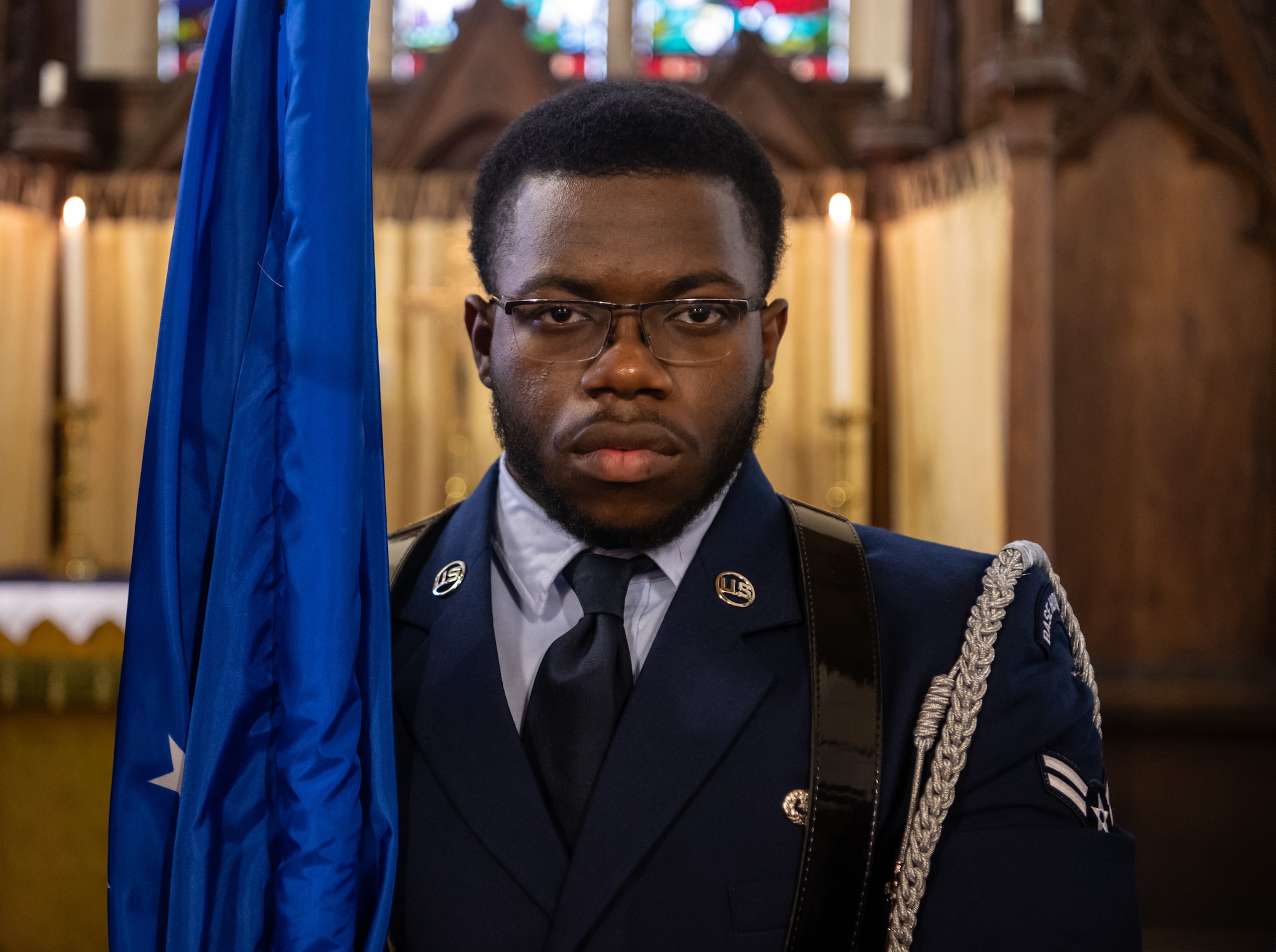 U.S. Air Force Airman 1st Class Idris Shaheed, Royal Air Force Mildenhall Honor Guardsman, stands at attention before the playing of the U.K. national anthem at the St. Andrews Church, Honingham Norfolk, England, Oct. 20, 2024.