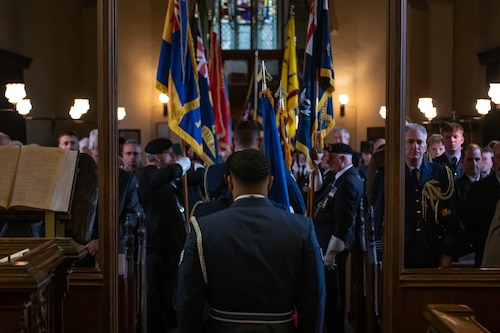 U.S. Airmen with the Royal Air Force Mildenhall Honor Guard march down the aisle of the St. Andrews Church after presenting the colors during a service commemorating the Battle of El Alamein at Honingham Norfolk, England, Oct. 20, 2024.