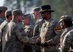 Command Sgt. Maj. LeVares J. Jackson, Division Command Sergeant Major of the 1st Cavalry Division, helps pin Army Accommodation Medals for soldiers who received zero failures on the task lanes during Expert Infantry, Soldier, and Field Medical Badge (E3B) qualifications near Drawsko Pomorskie Combat Training Center, Poland, Oct. 18, 2024. Soldiers are allowed to have one failure each day for any given lane, but they must successfully pass the lane the second attempt to continue. The E3B qualifications combined Expert Infantry, Expert Soldier, and Expert Field Medical Badges into one mass event as of 2021, and it is the first time this event has been held in Poland since its revision. (U.S. Army photo by Staff Sgt. Jasmine McCarthy)