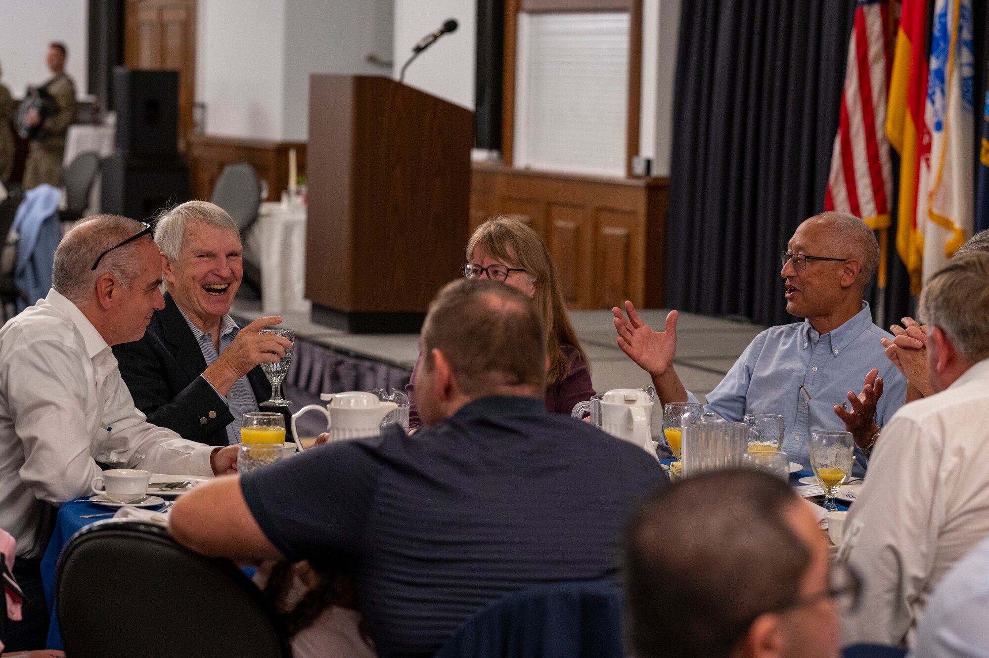 Retirees converse during the 2024 Military Retiree Appreciation Day event at Ramstein Air Base, Germany, Oct. 21, 2024.