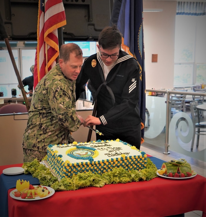 The installation celebrated the Navy's 249th birthday with a cake cutting and special meal at the Ney Hall Galley today. Installation Commanding Officer Capt. Henry Roenke cut the ceremonial cake with Master-At-Arms Seaman Joshua O'Neill, representing the senior officer and youngest Sailor in the command.