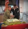 The installation celebrated the Navy's 249th birthday with a cake cutting and special meal at the Ney Hall Galley today. Installation Commanding Officer Capt. Henry Roenke cut the ceremonial cake with Master-At-Arms Seaman Joshua O'Neill, representing the senior officer and youngest Sailor in the command.