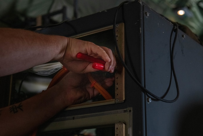 A 403rd Maintenance Squadron's Meteorological Equipment Technician's shop servicemember installed a KU Antenna on a WC-130J Super Hercules.
