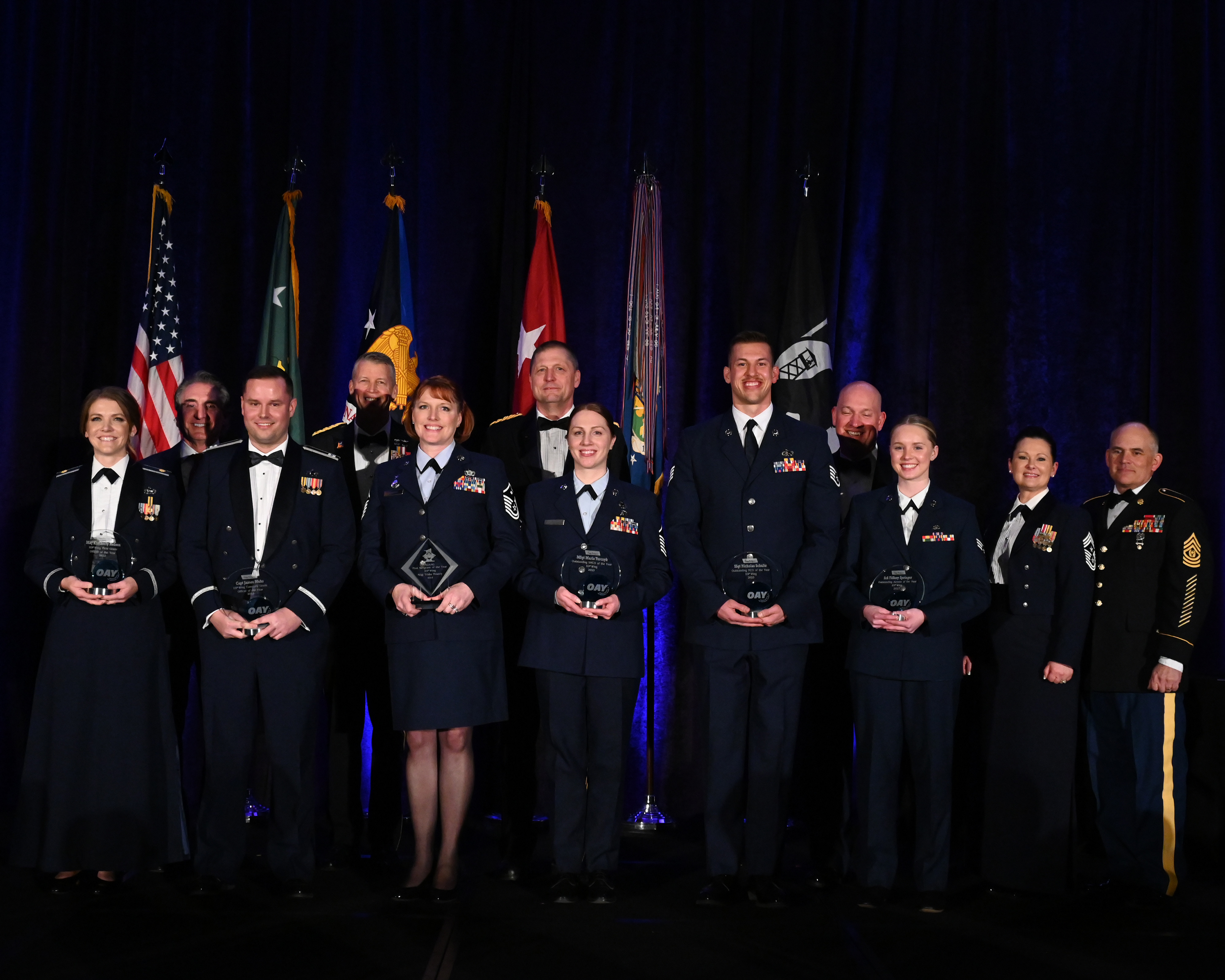 The 119th Wing honored the best of the best at the 2023 Outstanding Airmen of the Year Banquet on March 2, 2024 at the Hilton Garden Inn in Fargo, N.D.  Pictured L to R: Maj. Kimberly Nelson, N.D. Governor Doug Burgum, Capt. James Muhs, Gen. Daniel Hokanson, Master Sgt. Trish Mowery, Maj. Gen. Alan Dohrmann, Master Sgt. Maria Yurczyk,  Staff Sgt. Nicholas Schultz, Col. Christopher Domitrovich, Amn. First Class Tiffany Springer, Chief Master Sgt. MJ Filloon, Command Sgt. Maj. Jason Magnuson.